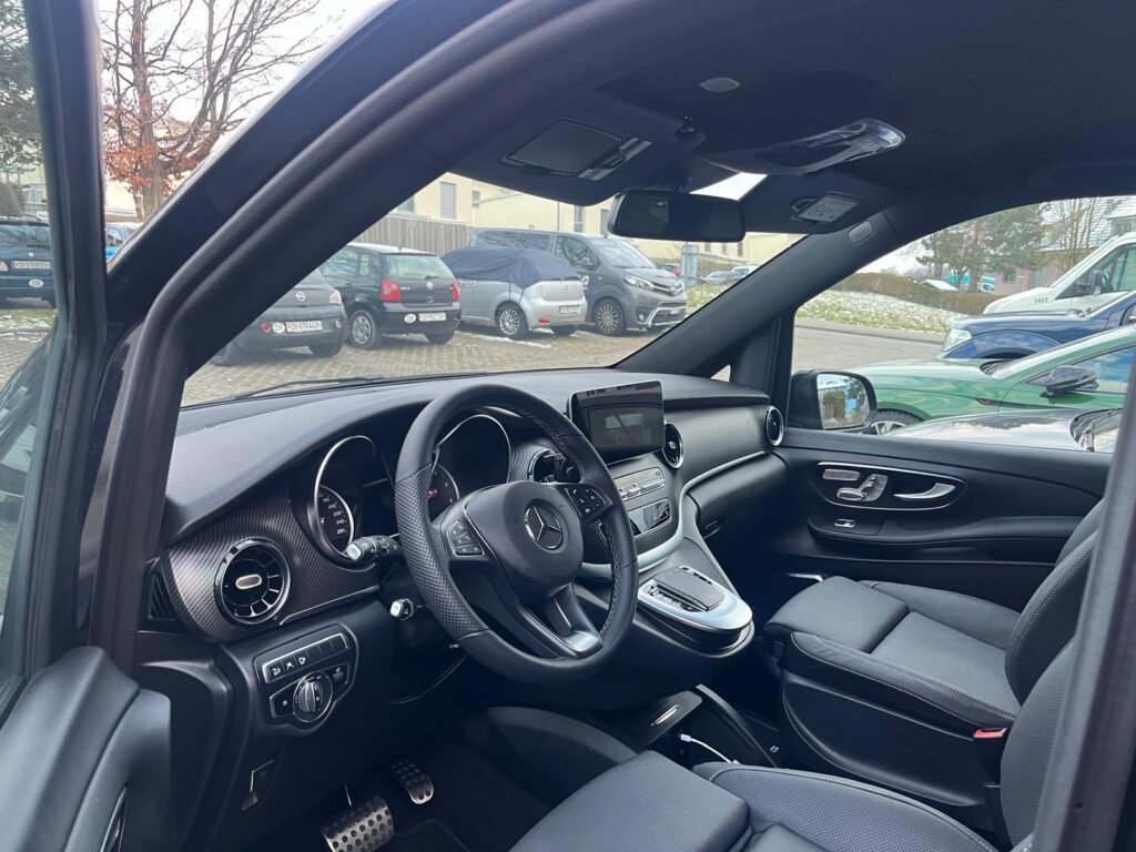 Private Transfers in Rome with luxury chauffeur vehicle driving past Colosseum for seamless city travel experience