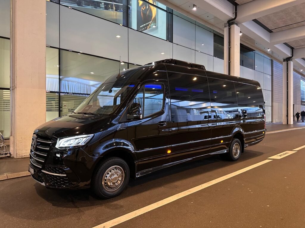 Private Transfers in Rome with luxury chauffeur vehicle driving past Colosseum for seamless city travel experience