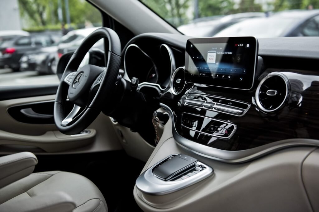 Private Transfers in Rome with luxury chauffeur vehicle driving past Colosseum for seamless city travel experience